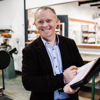 local-business-man-in-conversation-a-businessman-holding-a-book-trying-to-sell-his-products-brochure_t20_looga2